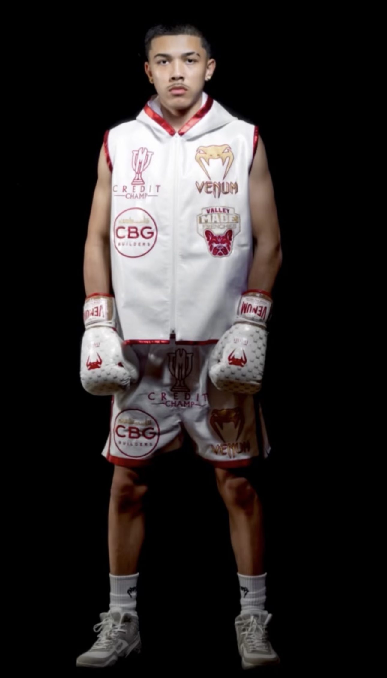 David "King" Garcia standing in fight kit, studio